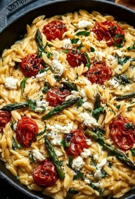 Baked feta orzo dish with fresh herbs and a cheesy finish