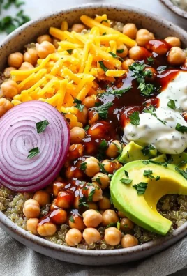 BBQ Ranch Chickpea Quinoa Bowls topped with fresh vegetables and dressing