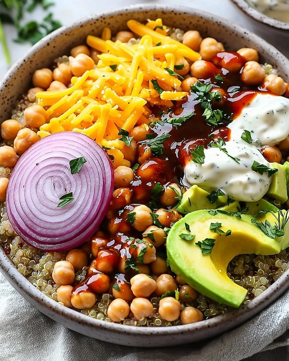 BBQ Ranch Chickpea Quinoa Bowls topped with fresh vegetables and dressing
