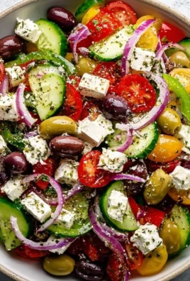 Delicious Greek Salad with fresh vegetables, feta cheese, and olives.