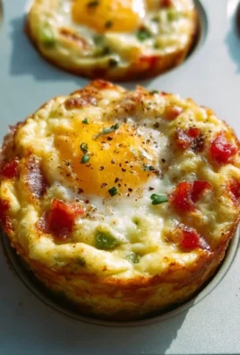 Healthy breakfast egg muffins prepared with vegetables and cheese