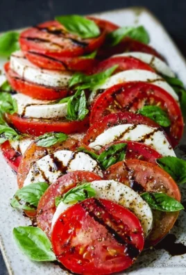 Delicious Caprese Salad with tomatoes, mozzarella, and basil garnish
