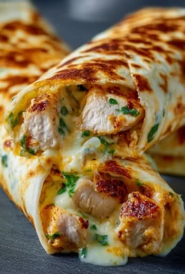 Cheesy garlic chicken wraps filled with gooey cheese and savory chicken