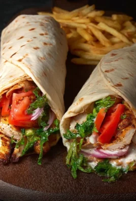 Chicken Shawarma Wrap filled with marinated chicken and fresh vegetables