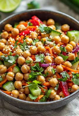 Crunchy Thai Chickpea Salad with fresh vegetables and herbs in a vibrant dressing