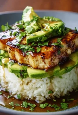 Honey lime chicken served with a fresh avocado rice stack