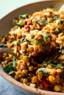 Bowl of Easy Mediterranean Lentils and Rice garnished with herbs and spices.