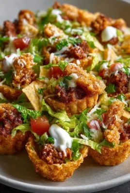 Delicious easy taco cups served on a plate with toppings