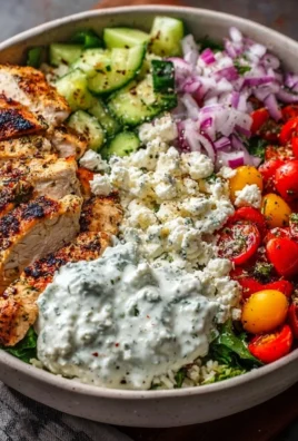Healthy Greek Chicken Bowls with fresh vegetables and flavorful toppings.