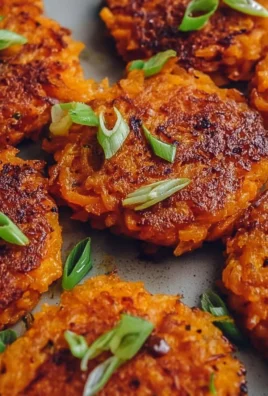 Healthy sweet potato hash browns served on a plate with herbs