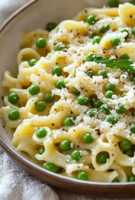Delicious plate of pasta and peas garnished with fresh herbs