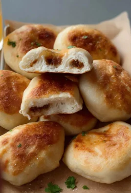 Delicious soft fried buns served on a plate.