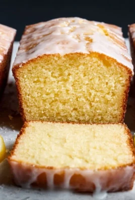 Homemade Starbucks copycat lemon loaf on a plate with lemon slices