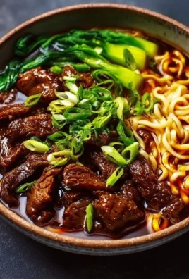Delicious sticky beef noodles garnished with vegetables