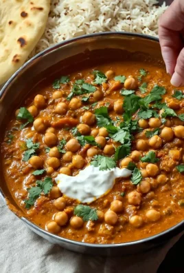 Vegan chickpea curry served in a bowl with fresh herbs and spices