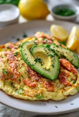 Avocado and smoked salmon omelet served on a plate