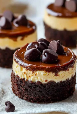 Brownie bottom mini cheesecakes topped with chocolate ganache