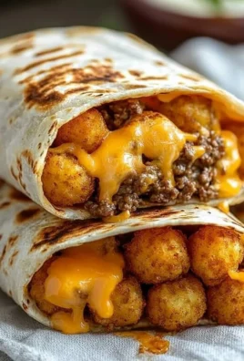 Cheesy potato burritos filled with creamy cheese and seasoned potatoes