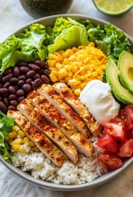 Delicious Chicken Burrito Bowls featuring seasoned chicken, rice, and fresh veggies