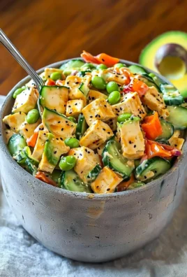 Creamy Asian cucumber salad with a tangy dressing and fresh vegetables