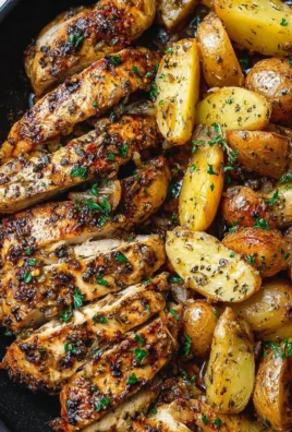 Delicious Garlic Butter Chicken served with crispy potatoes in a savory sauce.