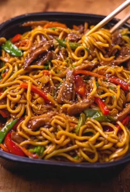 High-protein Chicken Chow Mein noodles meal prep in a colorful bowl