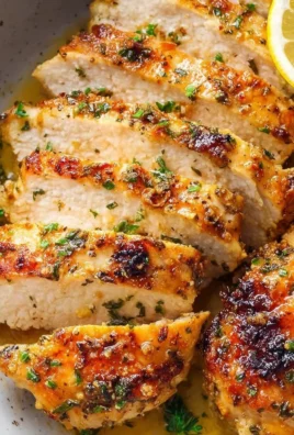 Lemon Garlic Chicken dish garnished with herbs and served on a plate