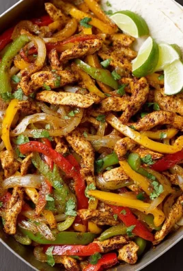 Oven-baked chicken fajitas with colorful bell peppers and spices
