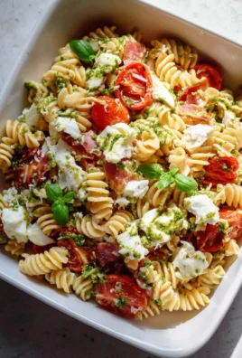 Radiator pasta salad with fresh vegetables and vinaigrette dressing