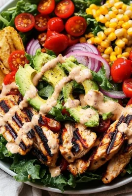 A vibrant bowl of Southwest Avocado Chicken Salad with fresh ingredients and chicken.