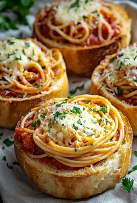 Spaghetti garlic bread bowls served with fresh herbs and cheese