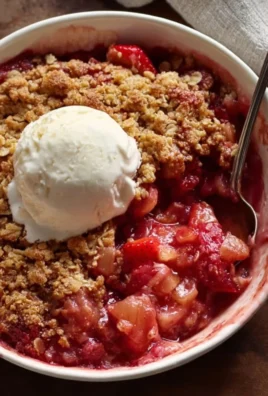 Delicious Strawberry Rhubarb Crisp with a golden crumble topping