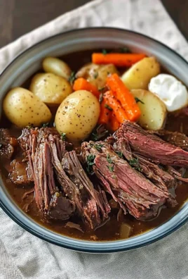 Delicious, tender pot roast cooked to perfection with vegetables.