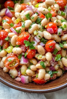 Colorful zesty bean salad with fresh vegetables and herbs