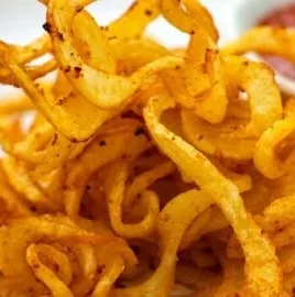 Delicious homemade air fryer curly fries served in a bowl