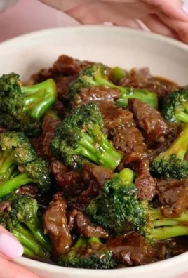 Beef and Broccoli Stir-Fry served in a bowl with vegetables and rice
