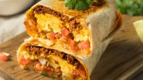 Delicious homemade breakfast burritos filled with eggs, cheese, and vegetables