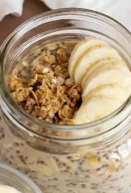Bowl of brown sugar overnight oats topped with fresh fruit and nuts