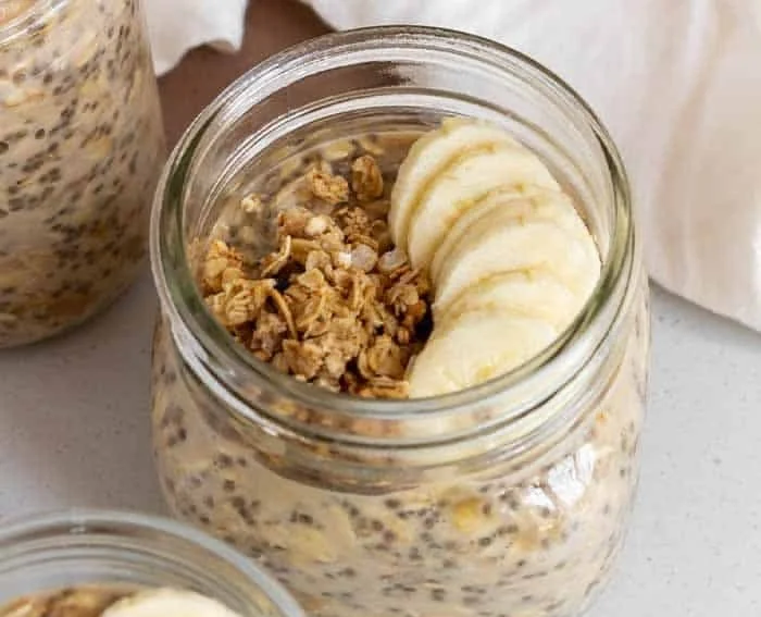 Bowl of brown sugar overnight oats topped with fresh fruit and nuts