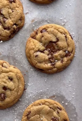 Delicious chewy chocolate chip cookies stacked on a plate