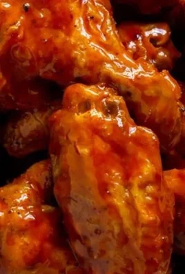 Crispy air fryer buffalo wings served with dipping sauce and celery sticks