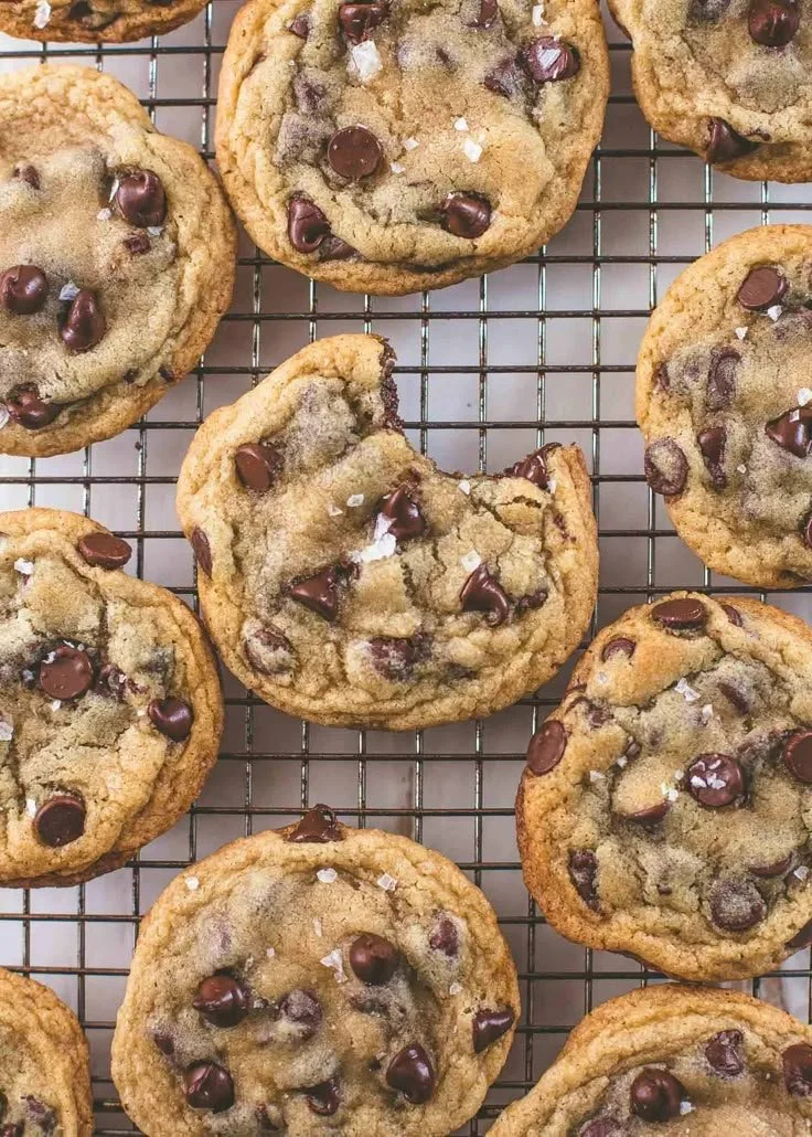 A plate of crispy and chewy chocolate chip cookies fresh out of the oven