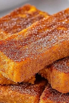 Delicious crispy pumpkin French toast sticks served with syrup