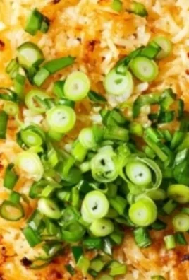 Delicious crispy rice dish topped with sesame seeds and herbs