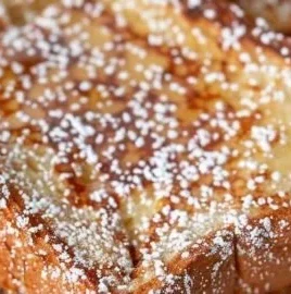 Air fryer French toast with golden crispy exterior and fluffy interior.
