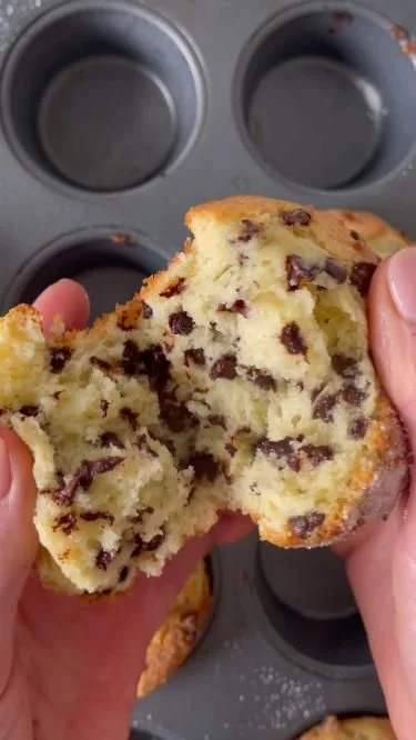 Homemade fluffy chocolate chip muffins with melting chocolate chips