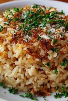 Delicious Garlic Parmesan Rice garnished with herbs