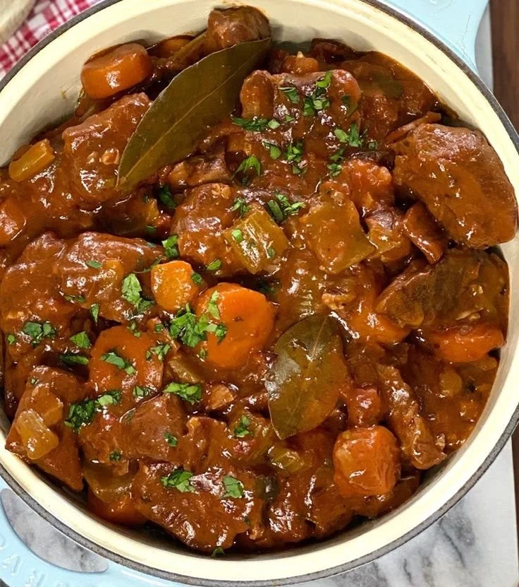 Delicious bowl of homestyle beef stew with vegetables and herbs