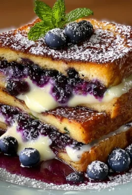 Delicious blueberry cheesecake stuffed french toast on a plate