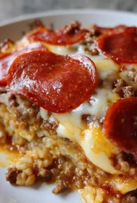 Low carb pizza casserole with cheese and toppings, ready to serve
